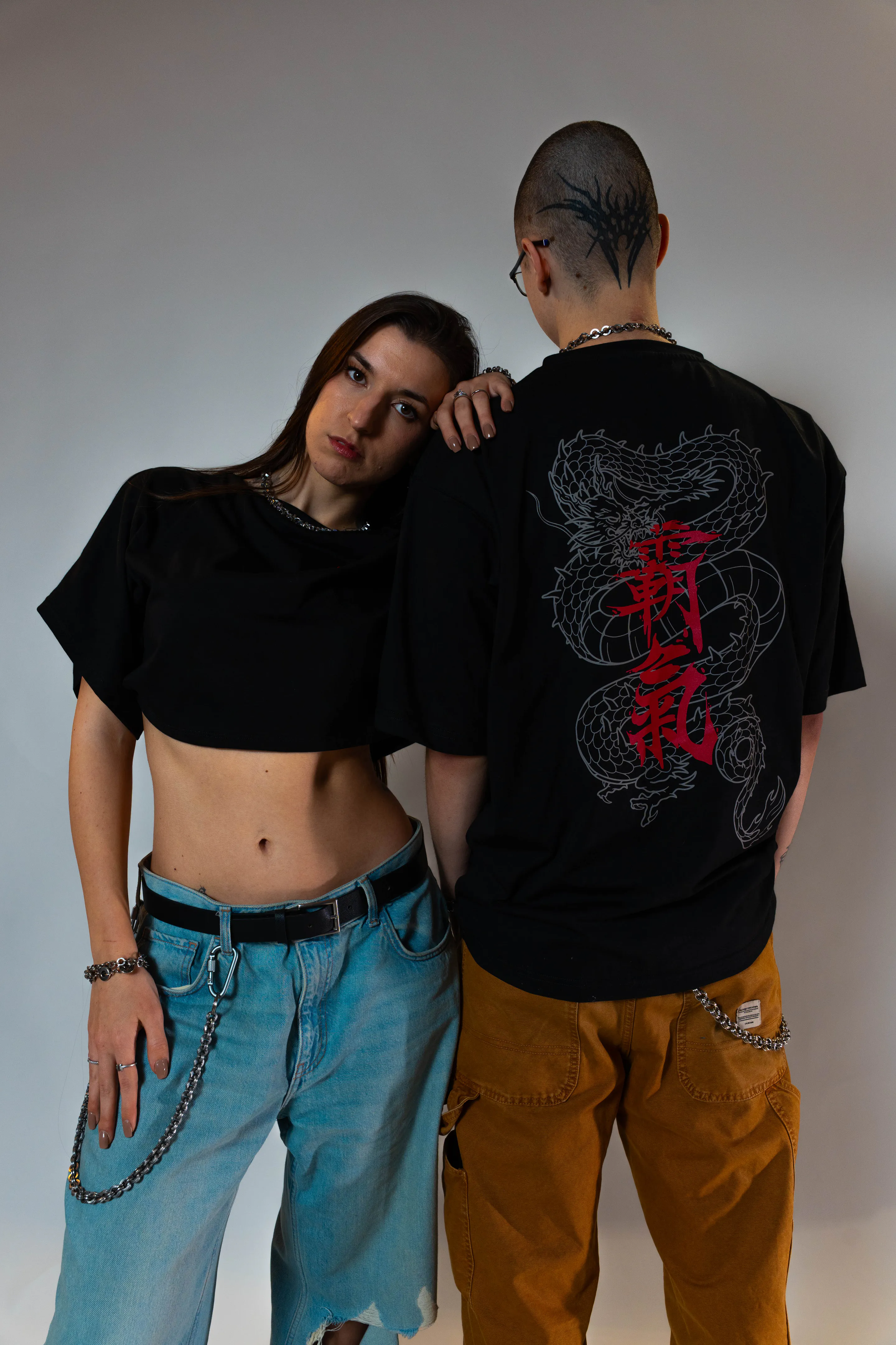 Head on his shoulder — the frayed-denim pair, the quiet pose of the shoot